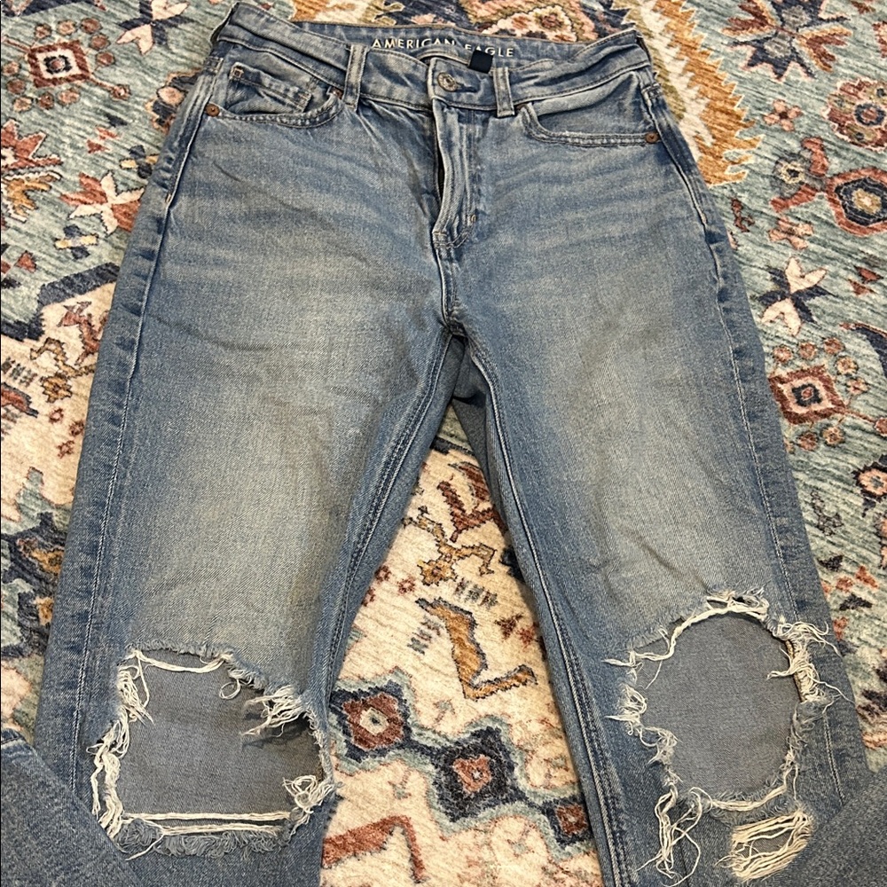 American Eagle Outfitters Blue Ripped Mom Jeans. Knee holes are a little worn.